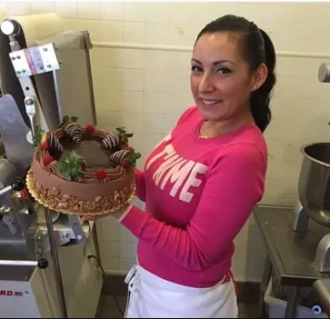Jessica Roche holding one of her custom cakes